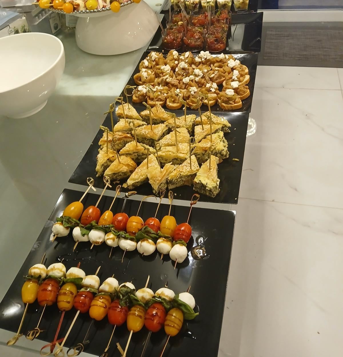 Passed hors d'oeuvres: caprese skewers, spanakopita and bruschetta